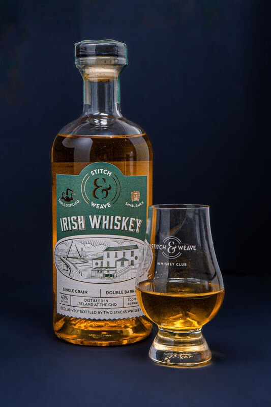 Whiskey bottle with glass